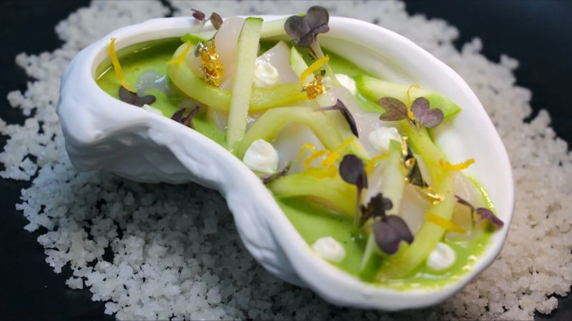 Shellfish on coarse salt with green sauce and gold leaf — God Save The Chef